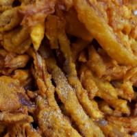 Onion Pakora [ V ] · Onion fritters made with thinly sliced onions, gram flour or besan batter and some spices.