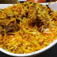 Goat Biriyani  [ Gf ] · Spiced basmathi rice cooked with goat biriyani masala. Comes with Raita and pickle.