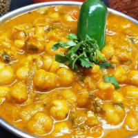 Channa Masala (Chickpeas)  & Rice [ V & Gf ] · Chickpeas, onions, tomatoes, spices and herbs.  [V- vegan can be made on request]