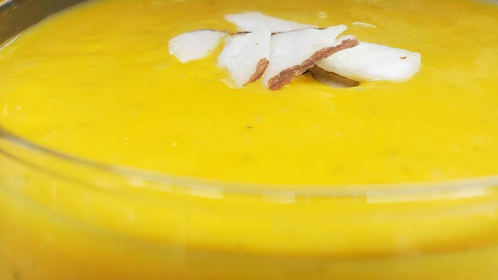 Mango Lassi [Gf] · Mango Lassi is a delicious blend of mangoes and yogurt with a touch of cardamom.
