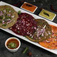 (4) Paradise Dosa Platter · A royal south Indian sampler plate of all (4) speciality street dosa, including Beetroot, Ca...