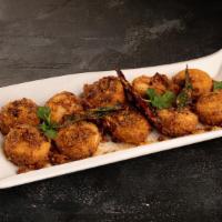 Podi Idli · Delicate flash-steamed rice cakes made from urad dal (black gram) and gently fried in tradit...