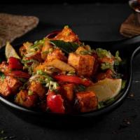 Chili Paneer · Deep fried paneer cubes sautéed with onions, bell peppers, and green chillies, tossed in our...