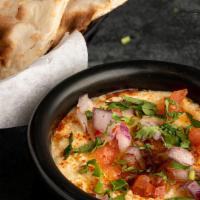 Hommus & Naan · House-made Hommus speciality from with fresh channa (chickpeas), tahini paste, olive oil, an...