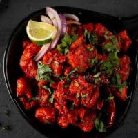 Chicken 65 · Boneless chicken pieces tossed with curry leaves, cumin seeds, green chili, and house specia...