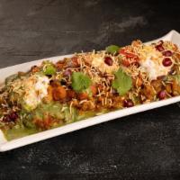 Paradise Eggplant Chaat · Roasted flavorful eggplant cooked with tadka, and served as chaat
with 'papri' crisps, chana...