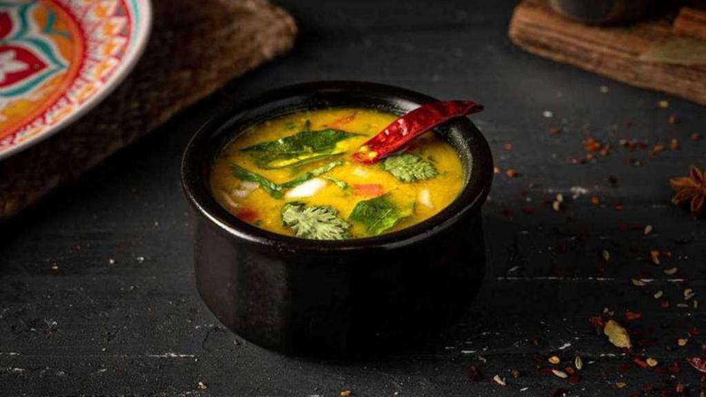 Lentil Dal Soup (Cup) · Hearty tadka-style soup made from stewed lentil, tomato, onion, cumin seeds, turmeric, and green chili