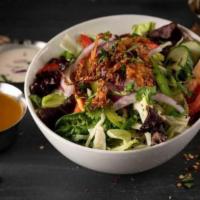 House Salad · Iceberg Spring Mix, Fine Indo-Chinese Veggies, Tomato, Cucumber; Red Onion, Crispy Fried Oni...