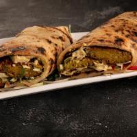Falafel N’ Hommus Roll · House-made Indian Falafel rolled with tandoori vegetables, fresh hommus, and chutney in para...