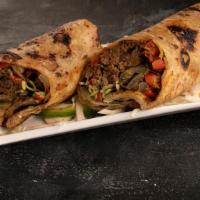 Lamb Seekh Kati Roll · Ground lamb kabobs made in tandoori clay oven, sautéed with onion and bell pepper and wrappe...