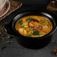 Creamy Veg Kurma · Mixed vegetables including carrot, cauliflower, zucchini, and potato simmered in unique cash...