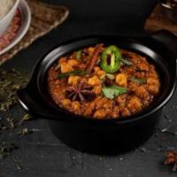 Channa Masala · Chickpeas cooked with diced onion, tomato, turmeric, and special South Indian curry