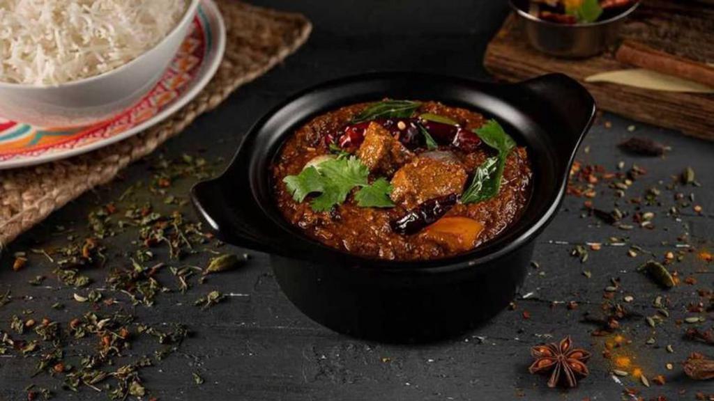 Hyderabad Lamb Curry · Tender lamb pieces cooked in savory kadai masala made from whole ground spices, tomato, onion, bell pepper in rich onion gravy