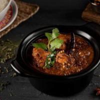 Paradise Chicken Curry · Chicken pieces cooked in tomato, onion, ginger-garlic paste with cumin seeds, curry leaves, ...