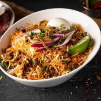 Keema Dum Biryani · Unique popular-layered rice dish cooked with minced goat meat and masala, Basmati rice, and ...