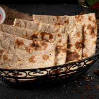 Tandoori Roti · Fresh home-made 100% atta wheat bread baked in clay oven