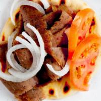 Gyro Sandwich · Gyro meat on a hot pita, topped with our own homemade gyro sauce with onions and fresh tomat...