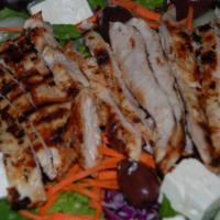 Greek Salad · Lettuce, tomato, green pepper, onion, cucumber, olives, feta cheese and Greek vinaigrette dr...