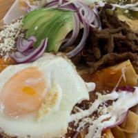 Chilaquiles  · Fried corn tortilla simmered with salsa (green orred sauce)
topped with onion, avocado,sour ...