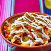 Supreme Nachos · Crispy fried tortilla chips topped with choice of meat and melted yellow cheese, sour cream,...