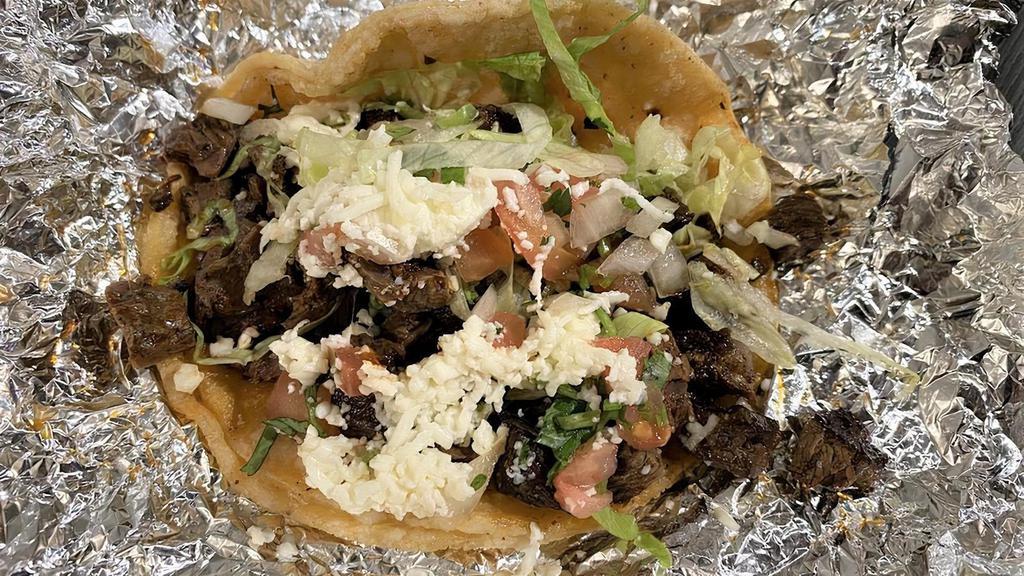 Grilled Steak Taco · Served on a corn tortilla and topped with lettuce, pico de gallo and queso fresco.