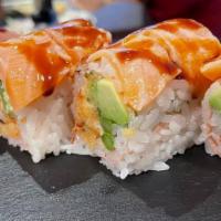Naked Girl Roll (8) · Lobster salad, avocado, asparagus and soy paper wrap topped with seared salmon and sweet eel...