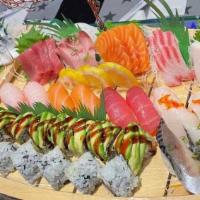 Love Boat · Ten pieces sushi and 18 piece sashimi with a rainbow roll and a dragon roll.