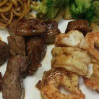 Hibachi Shrimp & Steak · Served with miso soup salad shrimp appetizer noodles vegetables steamed rice and shrimp sauce.