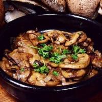 Garlic Mushrooms · Fresh medium size mushrooms sautéed in olive oil, garlic, and white wine.