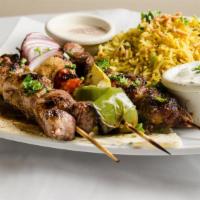 Lamb Kebab Platter · Marinated lamb, two  square of grilled lamb kebobs with tomatoes, green pepper and onion. Se...