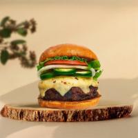 Hot Stuff Jalapeno Vegan Burger  · Seasoned plant-based patty topped with melted vegan cheese, jalapenos, lettuce, tomato, onio...