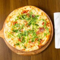 Arugula & Prosciutto Special Pizza · Garlic confit, mozzarella, provolone and truffle oil.