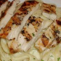 Chicken Alfredo · Seasoned grilled chicken topped with homemade alfredo sauce topped with parmesan flakes and ...