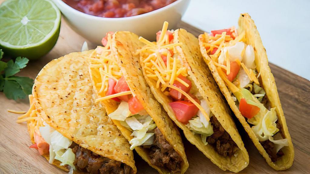 Tacos · Six tacos - chicken or seasoned ground beef topped with lettuce cheese, and tomatoes.