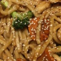 Udon Noodle · Udon noodles stir-fried with broccoli and eggs in teriyaki sauce sprinkled with roasted sesa...