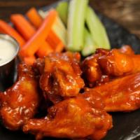 Traditional Classic · 8 classic buffalo sauce wings, served with carrots & celery and a choice of blue cheese or r...