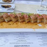 Cowboy Roll · choice of big eye tuna OR lobster mix and asparagus inside, topped with thinly sliced seared...