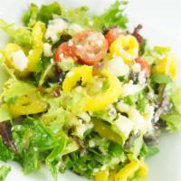 Greek Salad · Romaine lettuce, black olives, cucumbers, tomatoes, and feta cheese tossed in our Greek vina...