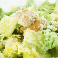 Caesar Salad · Romaine lettuce tossed in creamy caesar dressing topped with parmesan cheese and croutons. D...