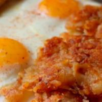Two Eggs · Served with two Grade AA farm fresh eggs, your choice of hash browns, fresh fruit, sliced to...