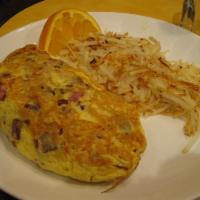 Meat Lover'S Omelette · For meat lovers – diced ham off the bone, bacon and sausage baked with Jack and cheddar chee...