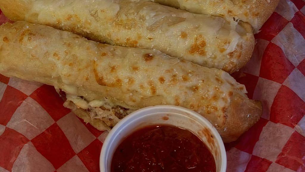 Bread Stix W/ Cheese · Six hand cut breadstix, made every day out of New York Dough. Topped with mozzarella cheese. Hot out of the oven!. Served with your choice of Chicago Pan marinara sauce or Famous Ranch Dressing.