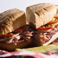 Italian Sub Sandwich · Hand sliced Fannestil ham, Genoa salami and provolone cheese topped with lettuce, tomato and...
