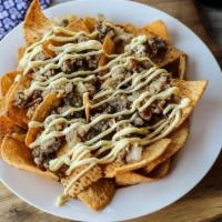 Nachos · With cheese options; jalapenos, add meat and sour cream for an additional cost.