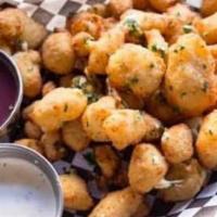 Cheese Curds · Breaded and fried White Cheddar Curds with choice of dipping sauce, Sweet Onion Jam, Marinar...