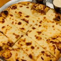 Cheesy Bread · Our Provolone and Mozzarella Cheese blend on top of our homemade pizza dough. Comes with a s...
