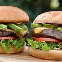 Avocado Cheddar Burger · 1/2 pound burger, Cheddar cheese, bacon, avocado, lettuce, tomato and special sauce on a bri...