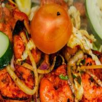 Tandoori Shrimp · Jumbo prawns marinated in yogurt, ginger garlic paste with special herbs and spices.