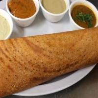 Plain Dosa · Rice and lentil savory crepe. Served with lentil soup and chutney.