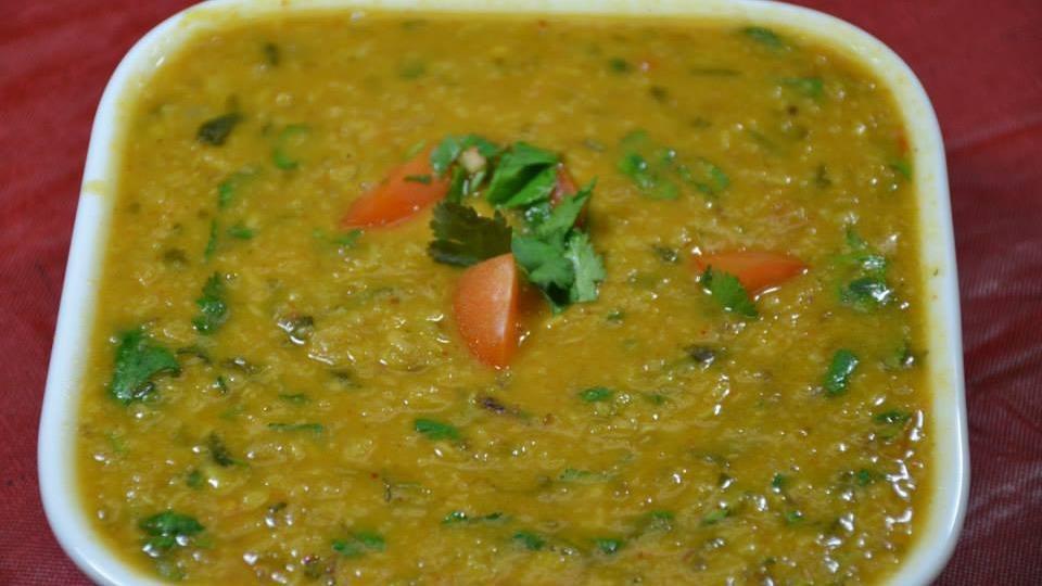 Tarka Daal · Yellow lentils cooked with Indian spices and finished with an aromatic tarka of onions, tomatoes, cumin and coriander.